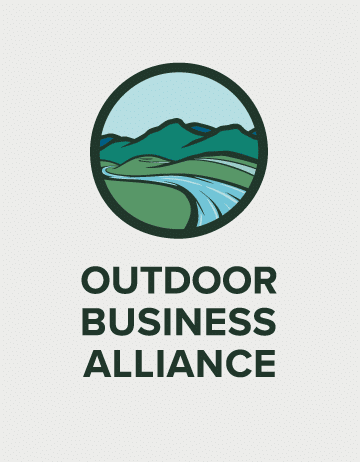 Logo for Outdoor Business Alliance featuring a circular graphic of green hills, a river, and a blue sky above the organizations name in bold dark green letters.
